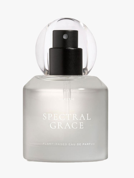 Transparent bottle of Heretic Spectral Grace Eau De Parfum with clear cap on light gray background 