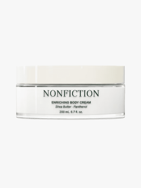 Nonfiction Enriching Body Cream in branded tub component on a light gray background